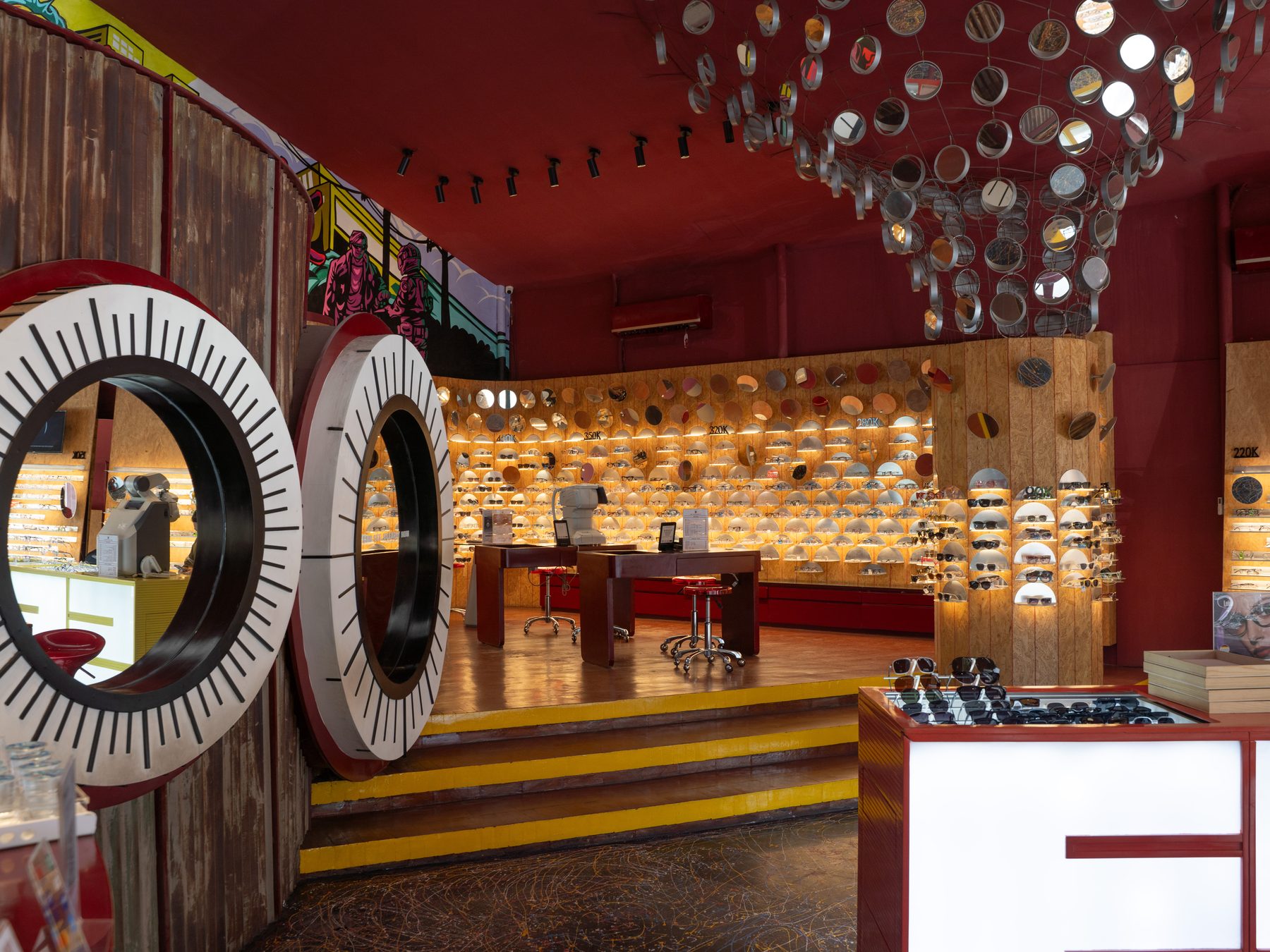 Yellow shelves and round mirrors inside the store