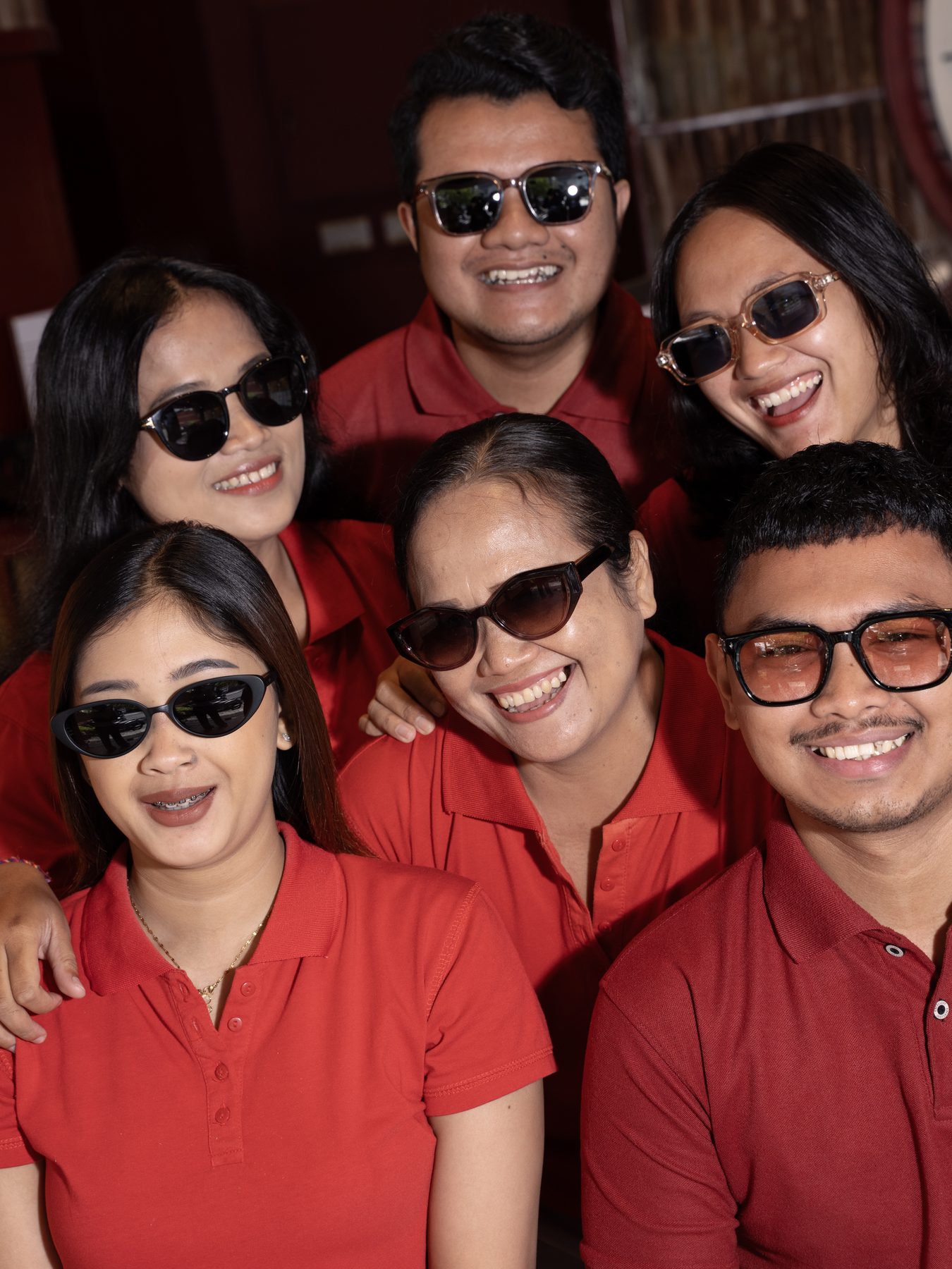 The Eye See You team in red shirts and sunglasses